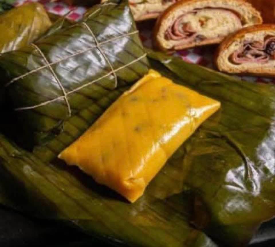Hallaca wrapped in banana leaf with pan de jamon