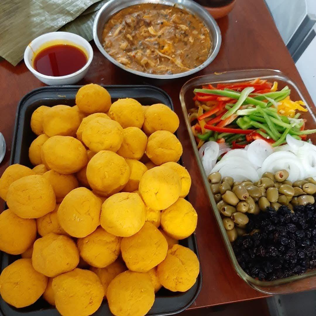 Hallaca dough balls with chicken filling and guiso ingredients