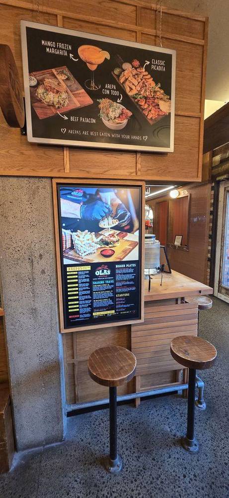 Olas Arepas menu board
