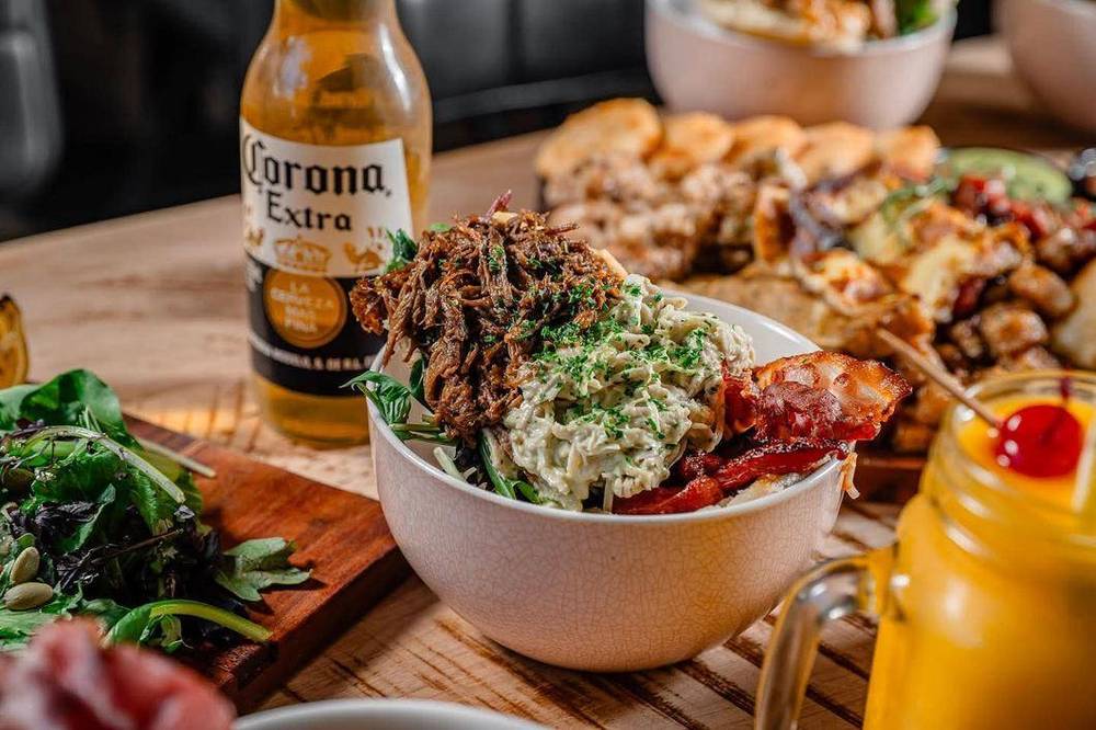Olas Arepas bowl with Corona