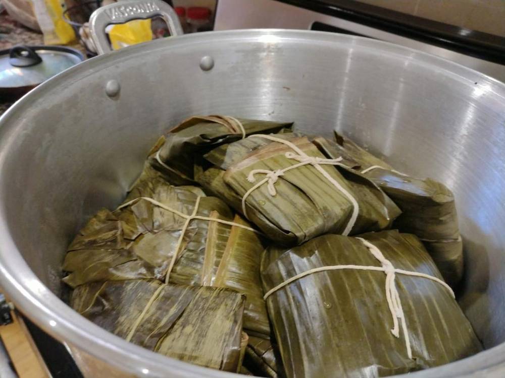 Pot of banana-leaf wrapped tamales
