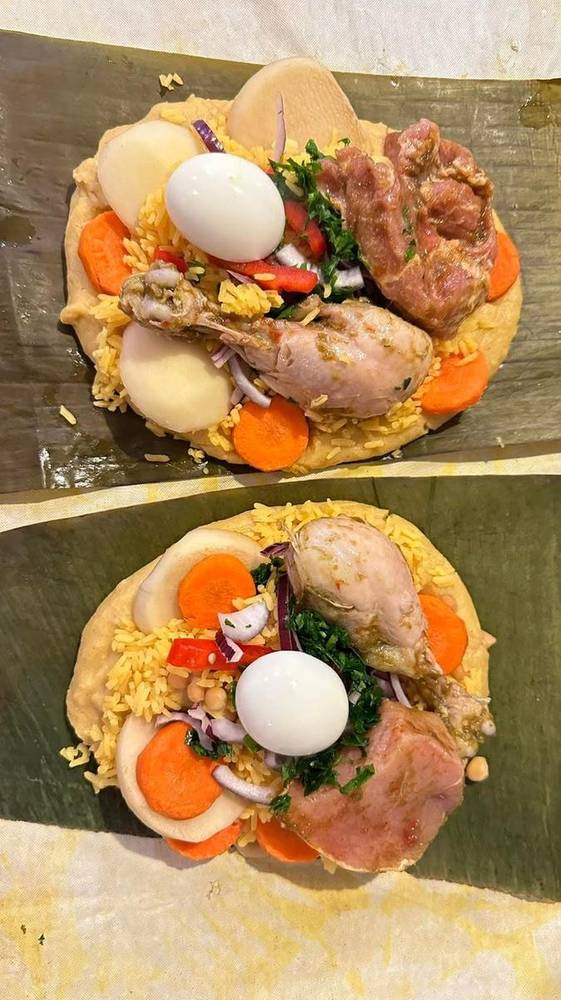 Two open tamales - chicken, egg, rice, carrots